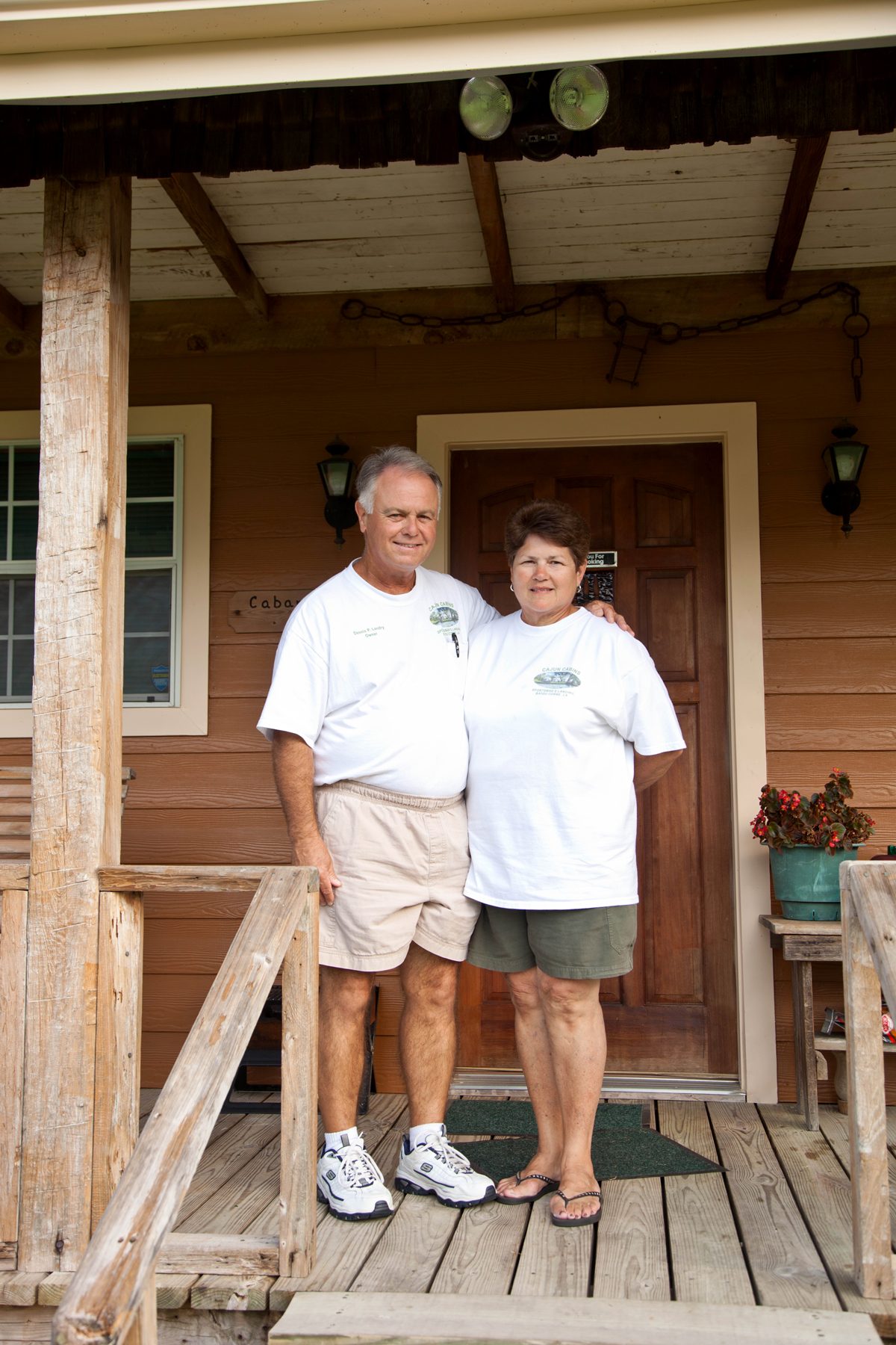 Dennis and Pat Landry at a cabin door