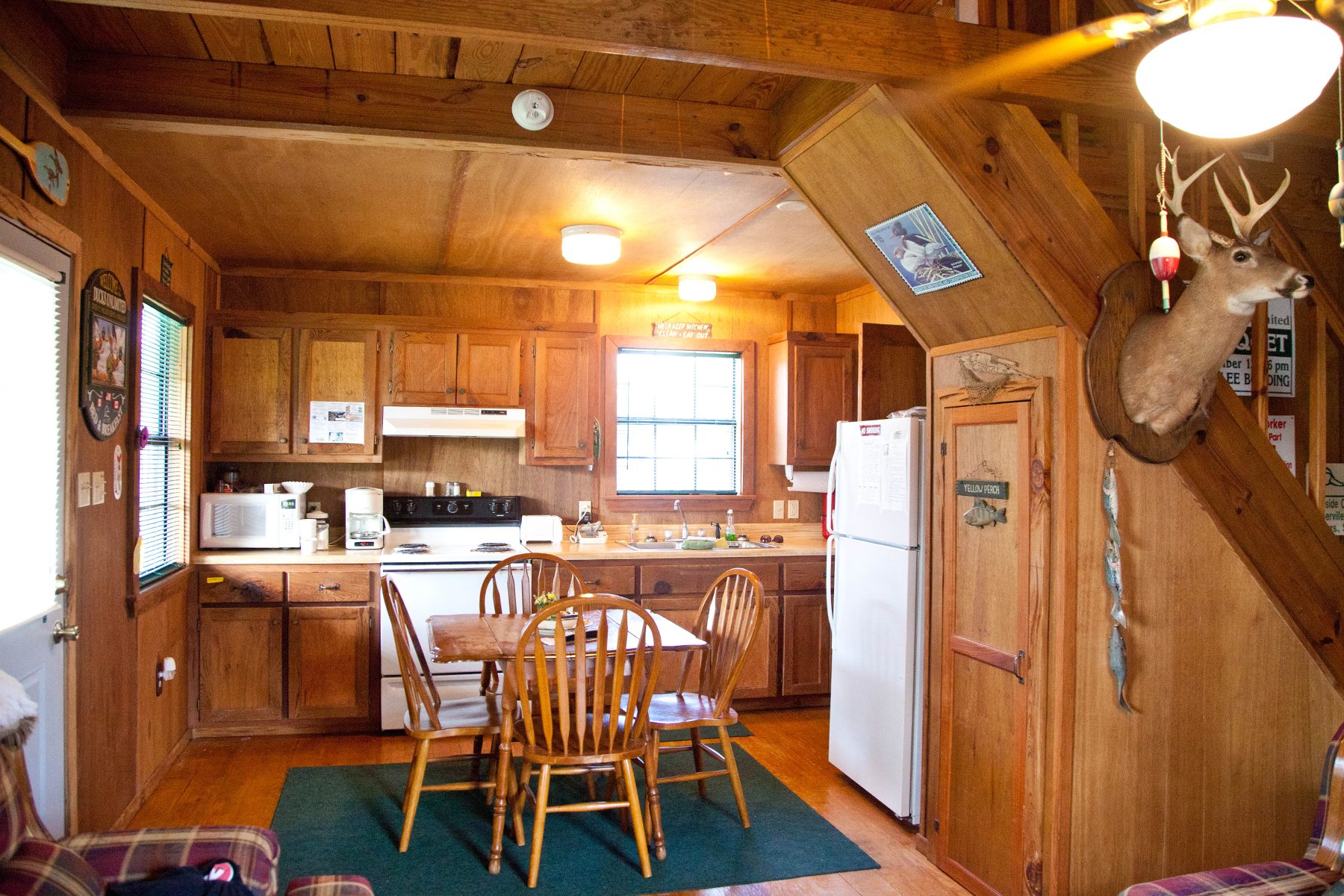 The dining table and kitchen in Bayou Retreat