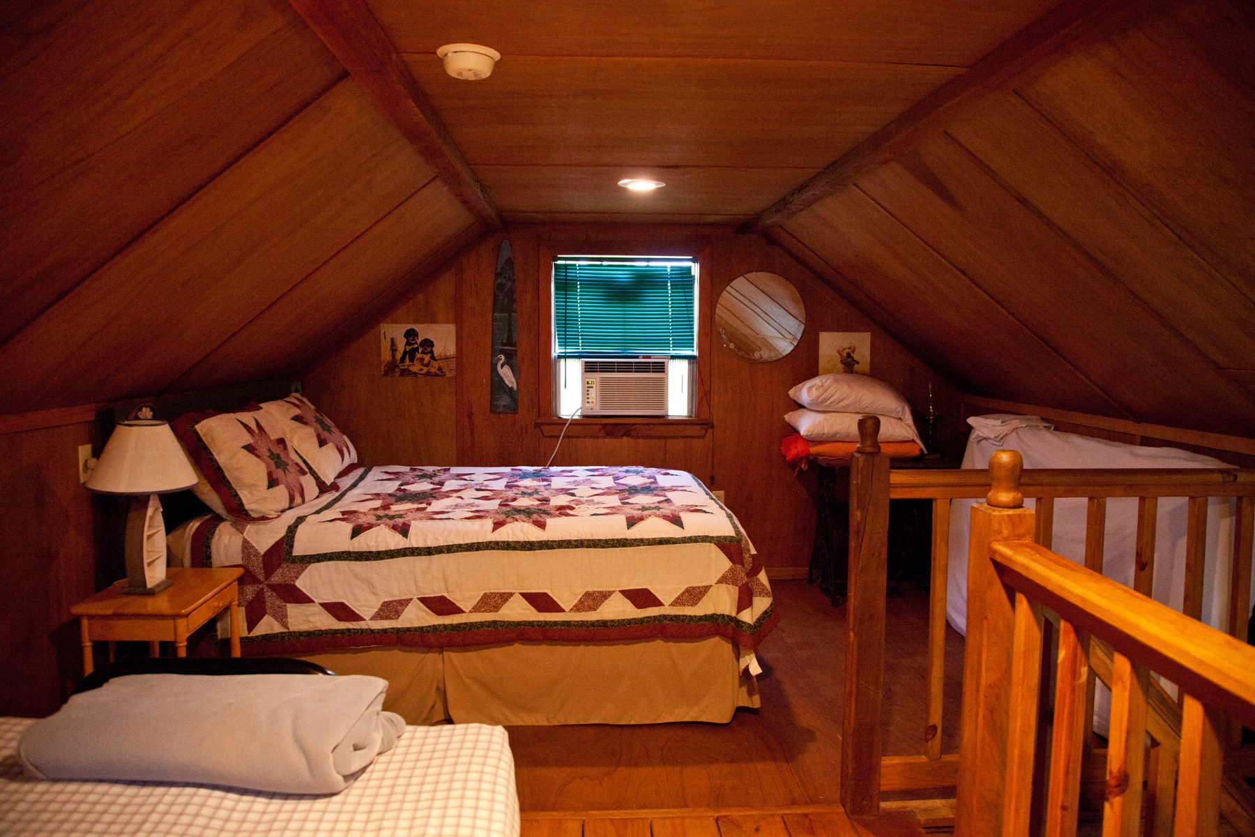 The queen bed in Bayou Retreat's loft