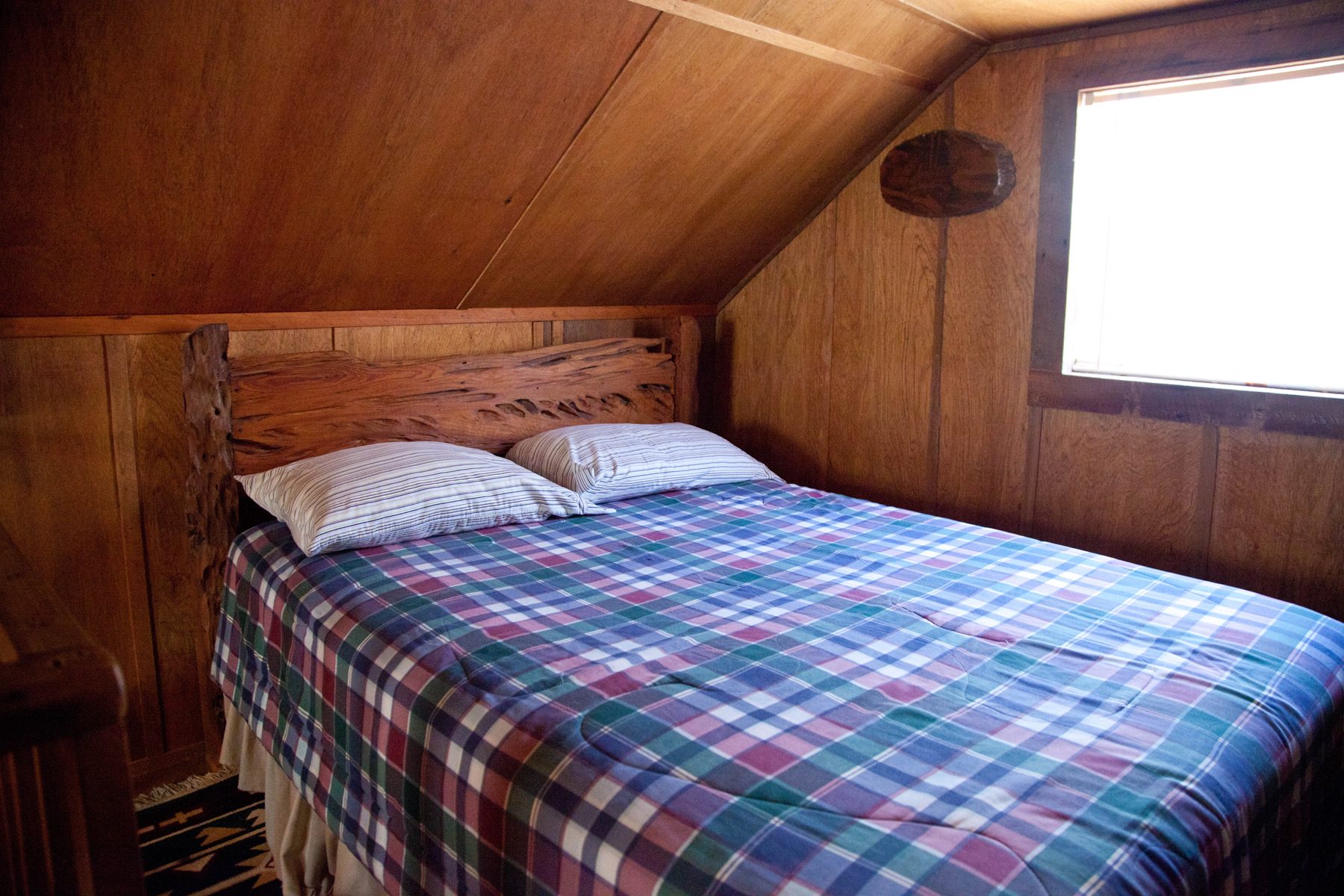 The queen bed in La Belle Rose's loft